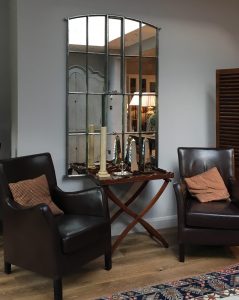 Interior polished mirror wal mounted with our bespoke unseen wall fixings