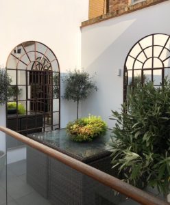 Arched Antique pair of Mirrors on our clients small balcony area