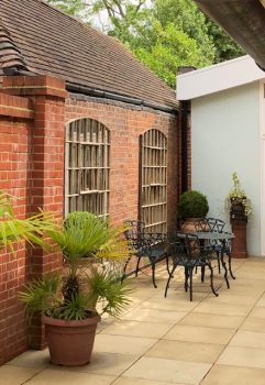 Stunning pair of vintage pieces to open and bring light to this courtyard area