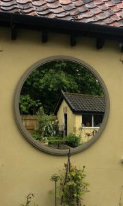 Bespoke Circular Mirror positioned to reflect our clients potting shed