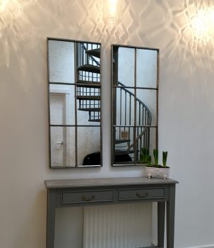 Architectural Mirror panels positioned tio reflect our clients spiral ironwork staircase
