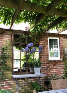 Antique Mirror displayed in a pergola area