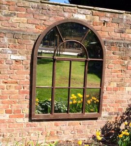 Arched Architectural Mirror wall mounted to reflect our clients garden area