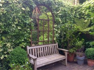 Large Full Arch Rustic Garden Mirror situated in this Living Wall feature for maximum stunning impact