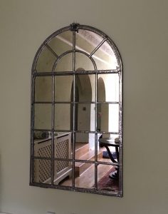 Full Arch hand polished mirror wall mounted in our clients hallway