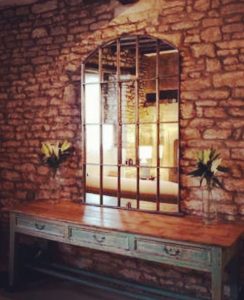 Window Mirror mounted on to the stone rock wall of this heritage property