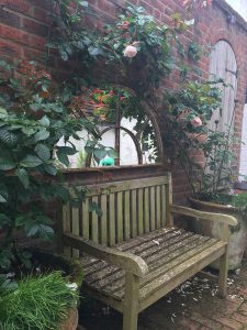 Semi Circle Rustic Mirror offering a great feature over this seating arrangement