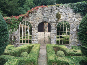 Double Full Arch displayed each side of this Arched entrance gate and reflecting our clients Topiary area